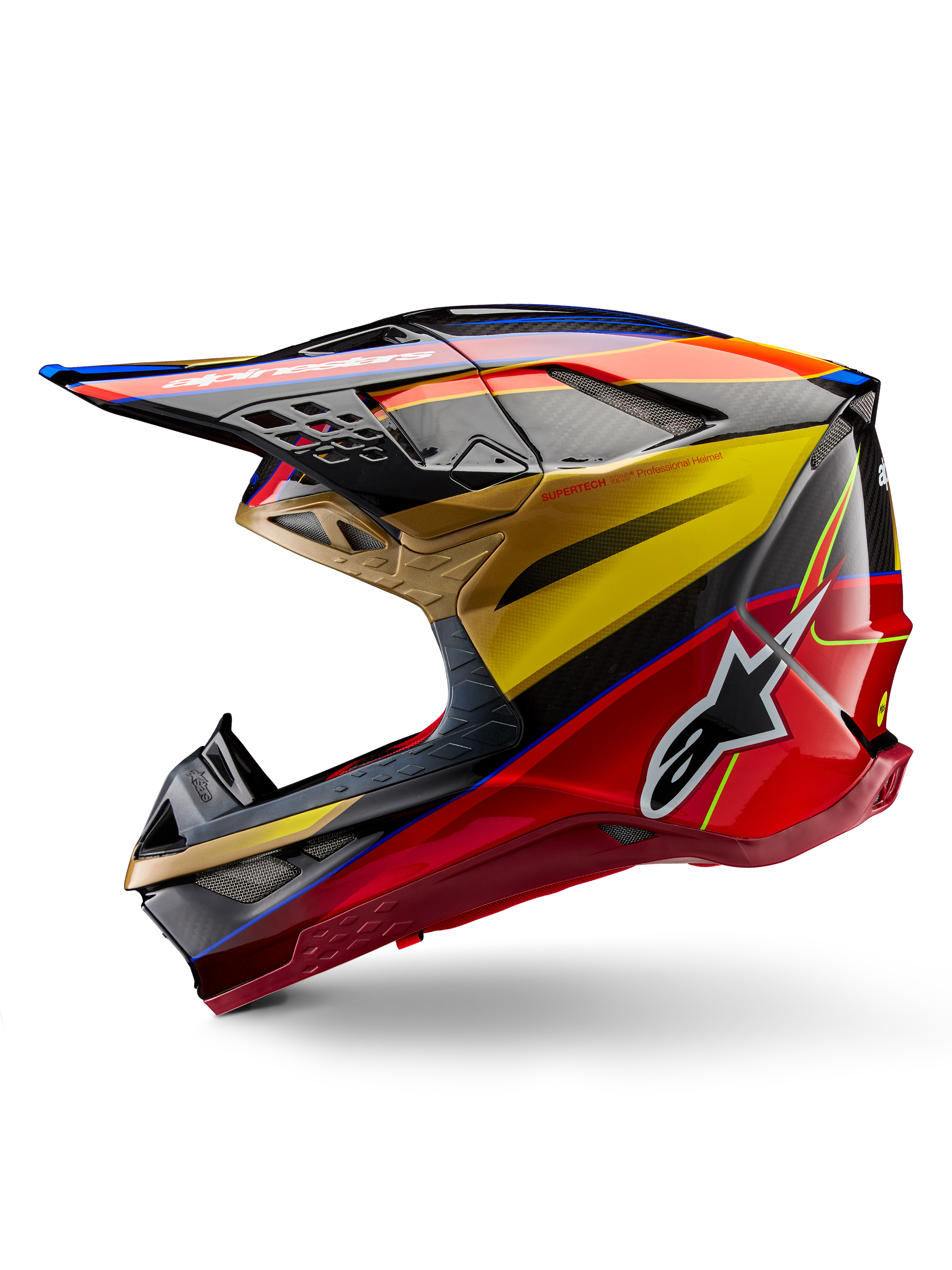 Casco Alpinestars Supertech M10 Era, casco da motocross, Oro Giallo Rio Rosso Lucido, profilo laterale con trama in fibra di carbonio e grafiche audaci, logo Alpinestars a stella, forma aerodinamica con diverse prese d'aria, protezione professionale per gare fuoristrada