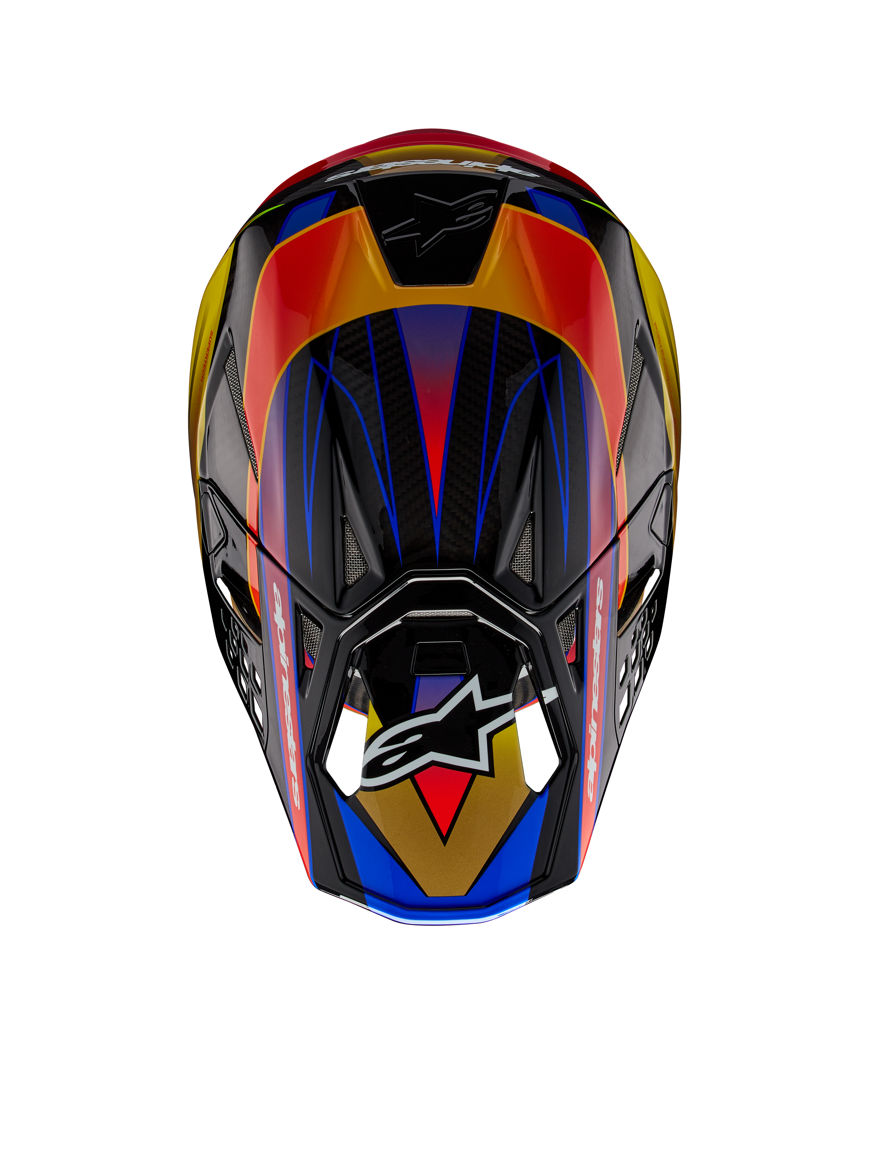 Casco Alpinestars Supertech M10 Era ECE, casco da motocross, Giallo Oro Rosso Rio Lucido, vista dall'alto con vivaci motivi geometrici in blu e giallo, finitura lucida con trama della calotta in carbonio a vista, con il logo Alpinestars sulla visiera