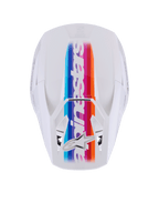 Casco Alpinestars S-M3 Force OCD, casco da motocross, bianco lucido, vista dall'alto con vivace striscia centrale multicolore in blu, viola, rosso e arancione, marchio e logo a stella Alpinestars bianchi, protezione professionale per la testa fuoristrada