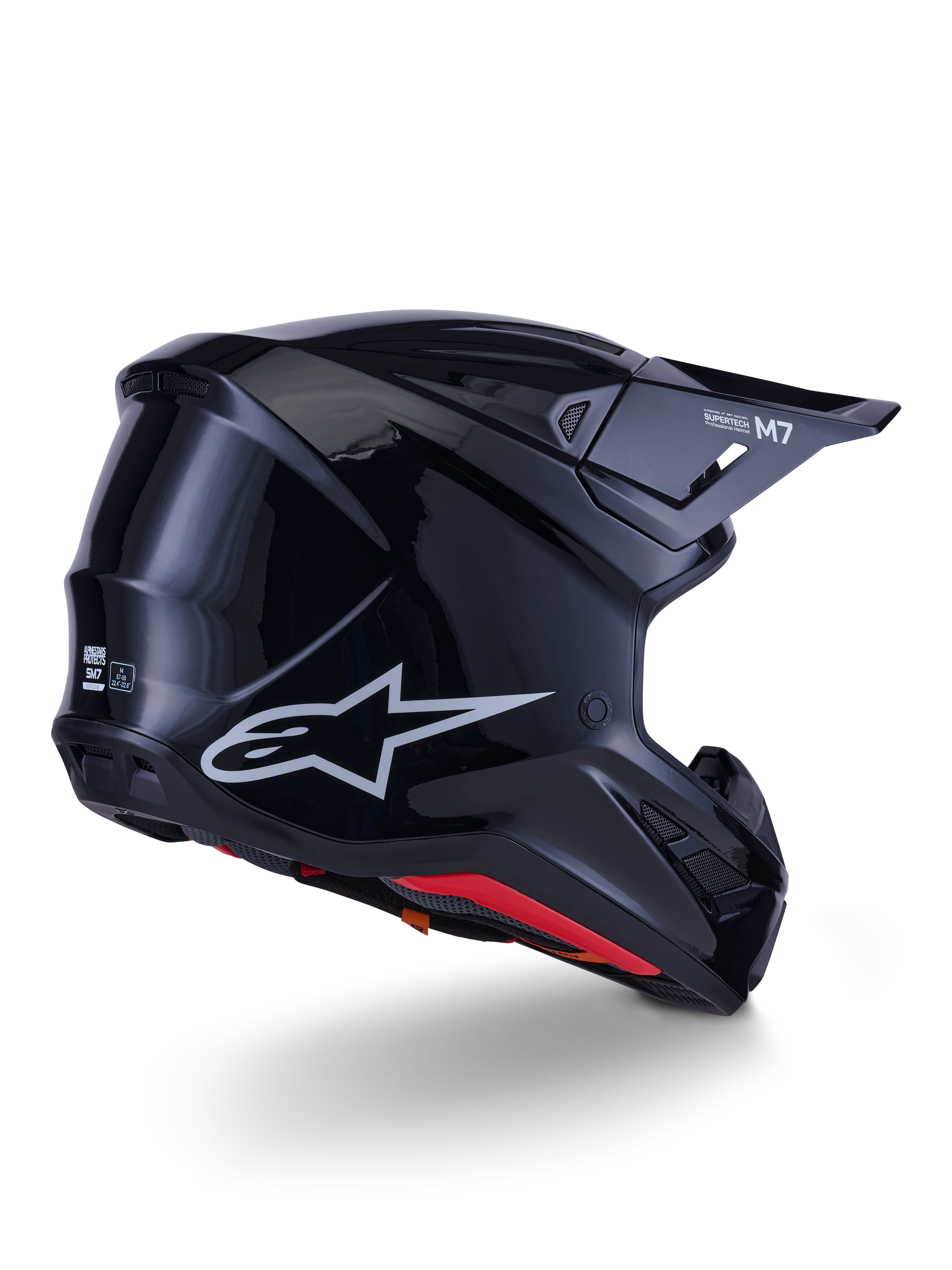 Casco Alpinestars S-M7 Solid, casco da motocross, nero lucido, caratterizzato da una calotta aerodinamica con logo Astars argento, finiture interne rosse e porte di ventilazione integrate, progettato per la protezione nelle corse fuoristrada