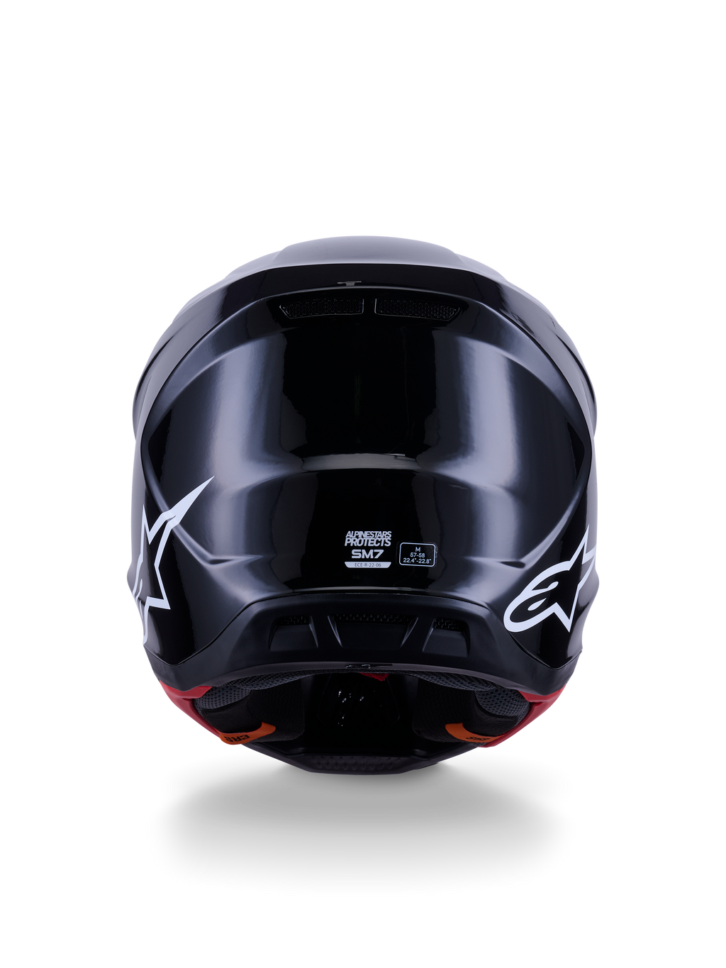 Casco Alpinestars S-M7 Solid ECE 22.06, casco da motocross, nero lucido, vista posteriore con loghi a stella bianchi, calotta aerodinamica in composito con finitura lucida, etichette di certificazione di sicurezza e taglia al centro