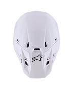 Casco Alpinestars S-M7 Solid, casco da motocross, bianco lucido, vista dall'alto con calotta aerodinamica profilata, prese d'aria nere, logo Astar nero e marchio M7 sul frontino, equipaggiamento da gara off-road ad alte prestazioni