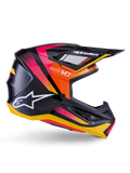 Casco Alpinestars S-M7 Rise, casco da motocross, nero lucido con grafiche rosa, arancione e giallo, vista laterale, con logo Alpinestars e visiera bianchi, calotta aerodinamica con prese d'aria integrate