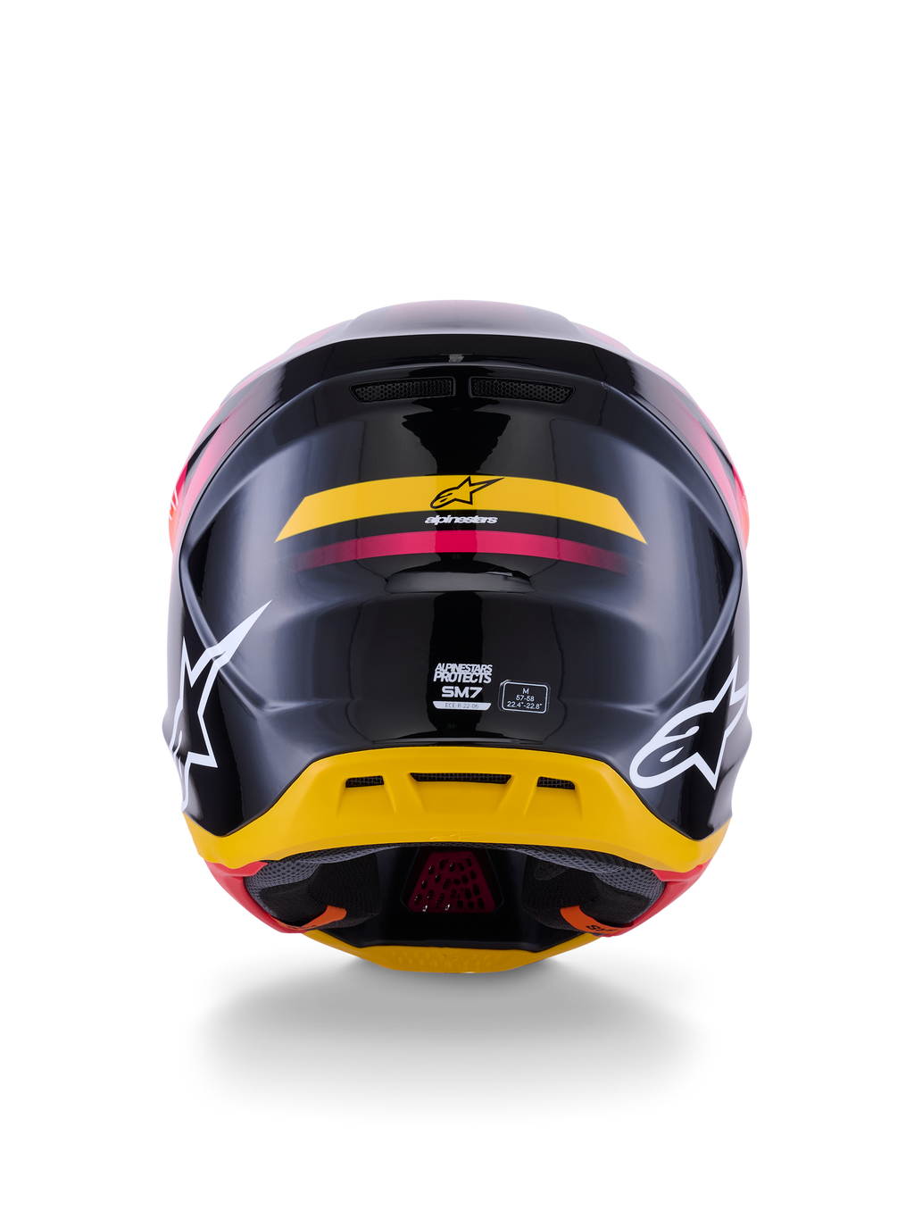 Alpinestars S-M7 Rise Helmet ECE 22.06, casco da motocross, vista posteriore, nero lucido con accenti gialli e rosa, grandi loghi bianchi sui lati, calotta aerodinamica in materiale composito, equipaggiamento da gara off-road