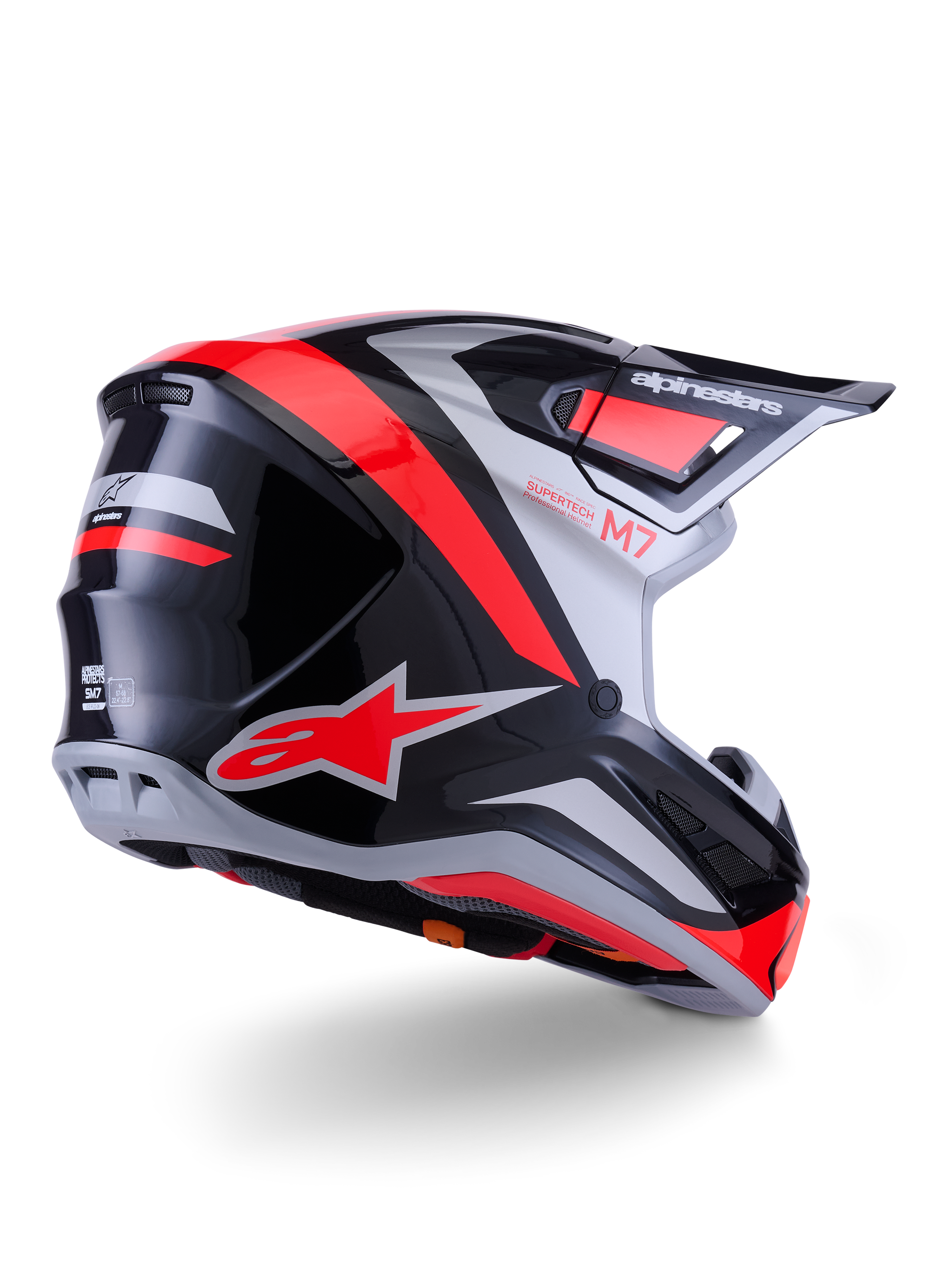 Casco Alpinestars S-M7 Rise, casco da motocross, nero, argento e rosso fluo lucido, vista posteriore di tre quarti, con logo A-star rosso e accenti argento, calotta aerodinamica con visiera, protezione professionale per il fuoristrada