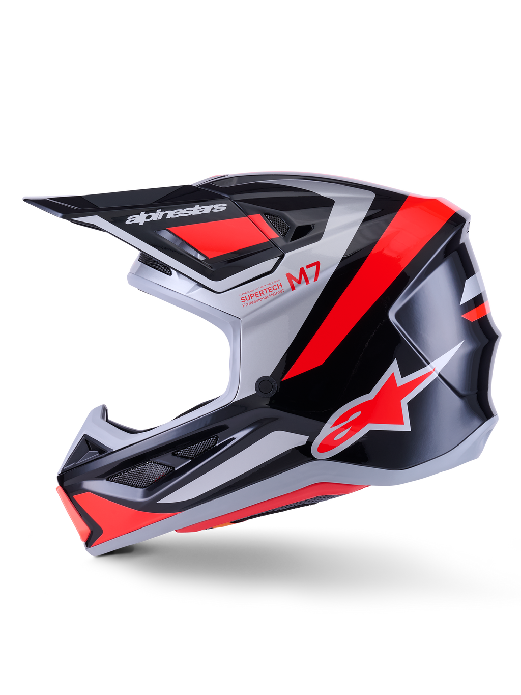Casco Alpinestars S-M7 Rise, casco da motocross, nero, argento e rosso fluo lucido, vista laterale con calotta aerodinamica in materiale composito, mentoniera ventilata e visiera con logo Alpinestars.
