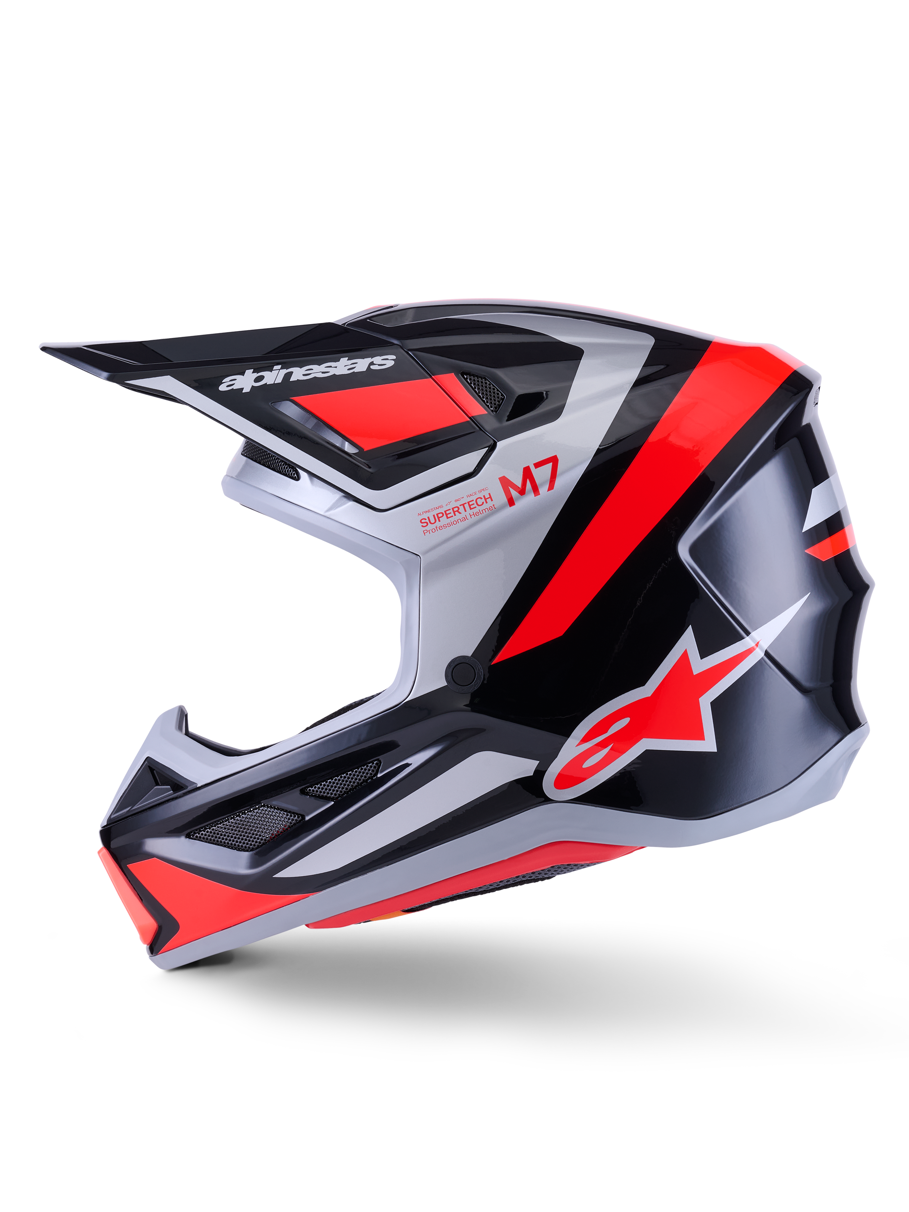 Casco Alpinestars S-M7 Rise, casco da motocross, nero, argento e rosso fluo lucido, vista laterale con calotta aerodinamica in materiale composito, mentoniera ventilata e visiera con logo Alpinestars.