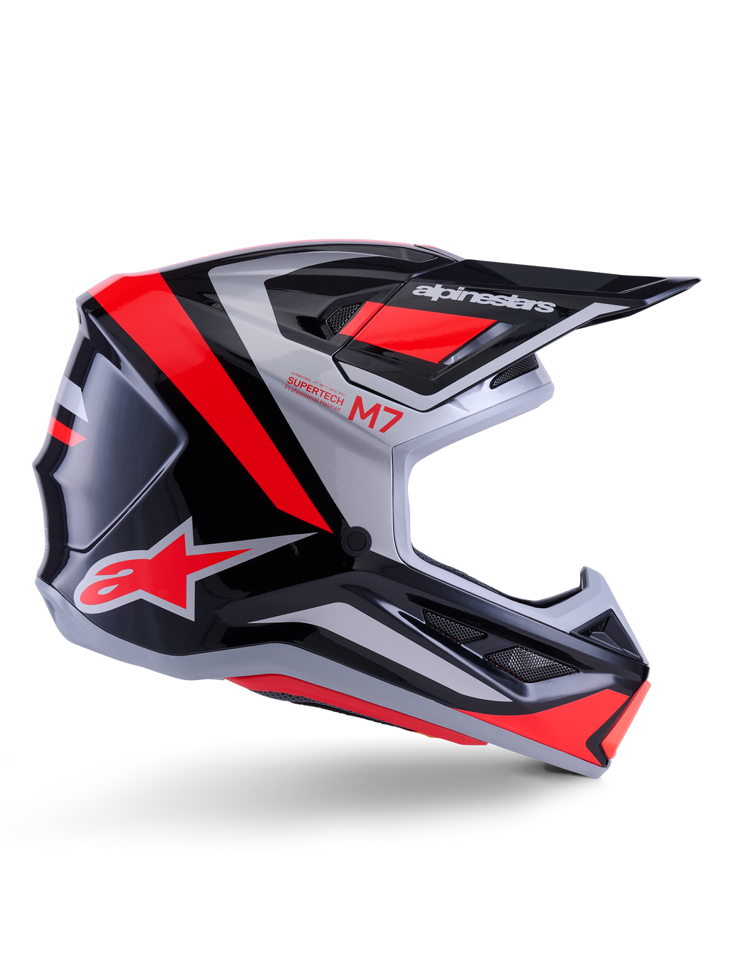 Casco Alpinestars S-M7 Rise, casco da motocross, nero, argento e rosso fluo, vista laterale con design aerodinamico angolare, visiera e prese d'aria, finitura lucida, serie Supertech M7