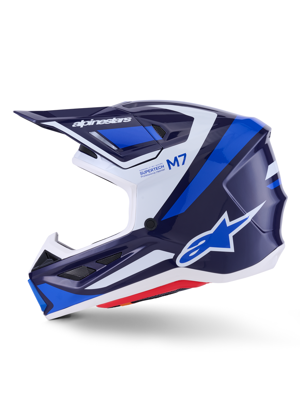 Casco Alpinestars S-M7 Rise, casco da motocross, blu, bianco e navy lucido, vista di profilo laterale con marchio Alpinestars sulla visiera e sul fianco, scritte M7 e Supertech, calotta aerodinamica con prese d'aria, finitura lucida per prestazioni off-road