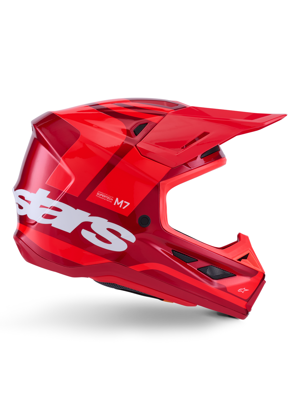 Casco Alpinestars S-M7 Core, casco da motocross, rosso lucido con accenti rosso scuro e branding bianco, vista laterale con grande logo stars bianco, calotta aerodinamica con prese d'aria in rete e visiera prominente