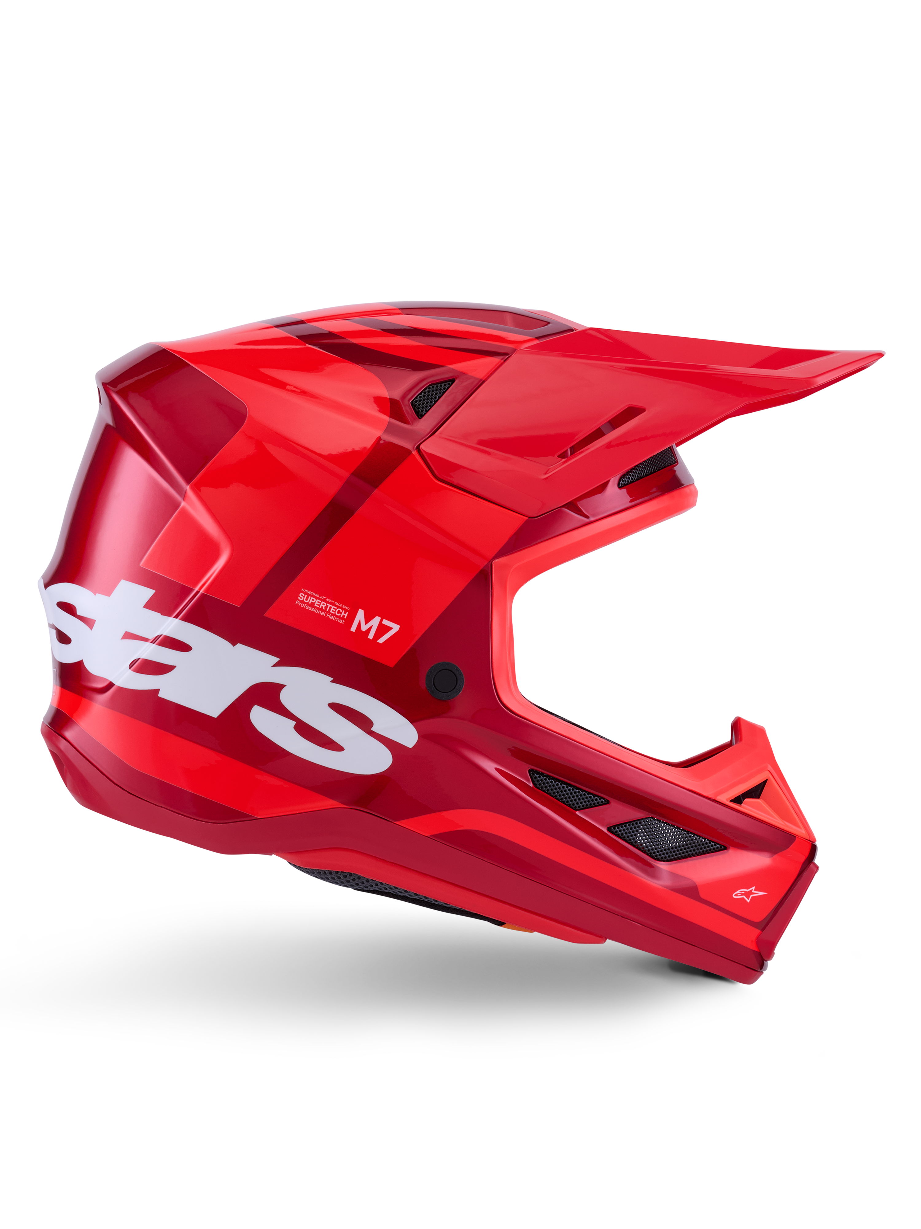 Casco Alpinestars S-M7 Core, casco da motocross, rosso lucido con accenti rosso scuro e branding bianco, vista laterale con grande logo stars bianco, calotta aerodinamica con prese d'aria in rete e visiera prominente