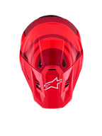 Casco Alpinestars S-M7 Core, rosso lucido, vista dall'alto con calotta aerodinamica e accenti rosso scuro, logo A-star bianco sulla visiera, porte di ventilazione integrate, equipaggiamento protettivo da motocross ad alte prestazioni