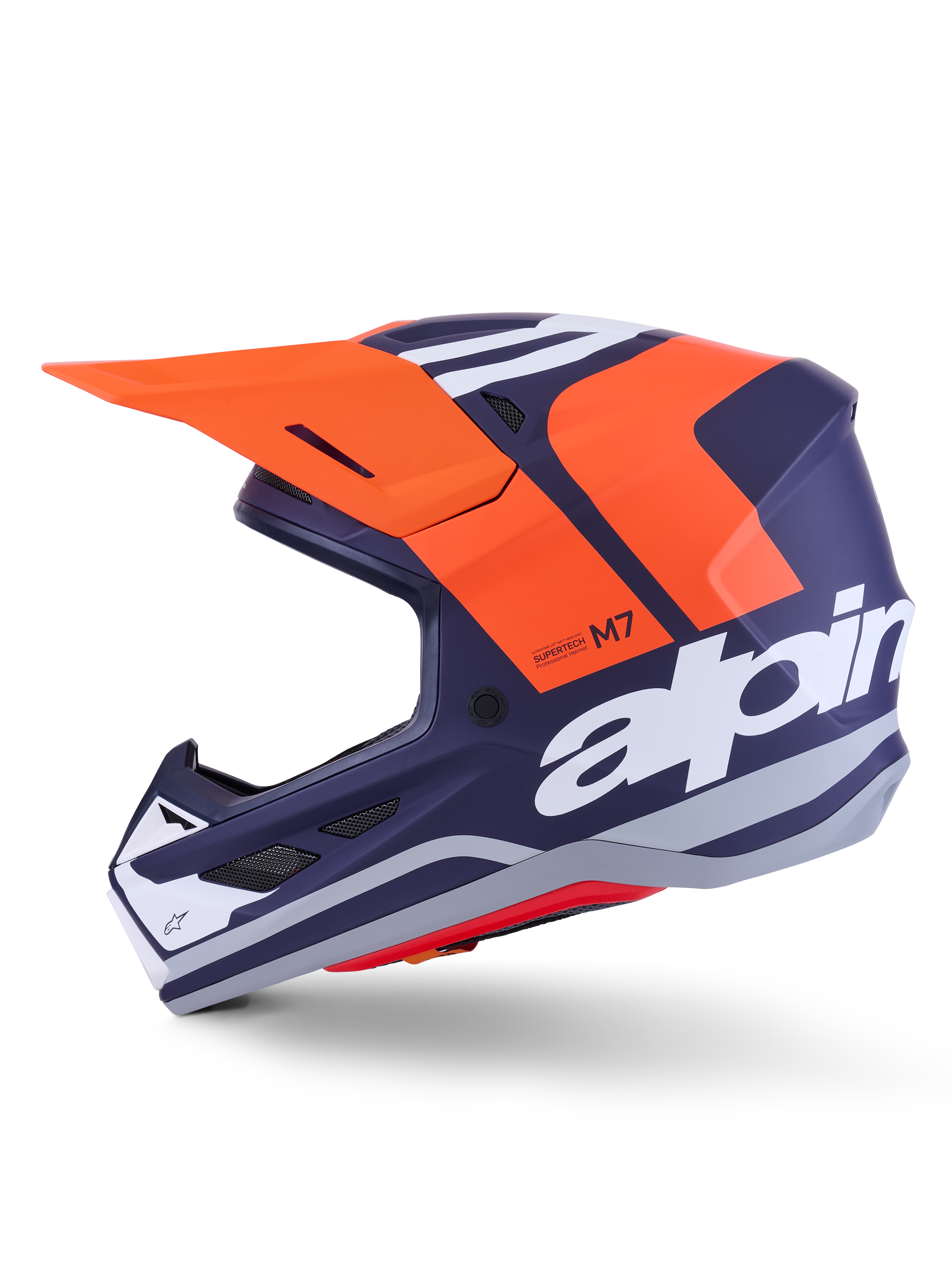 Casco Alpinestars S-M7 Core ECE 22.06, profilo laterale, finitura opaca blu navy e arancione, grande logo bianco laterale, casco da motocross aerodinamico con visiera protettiva