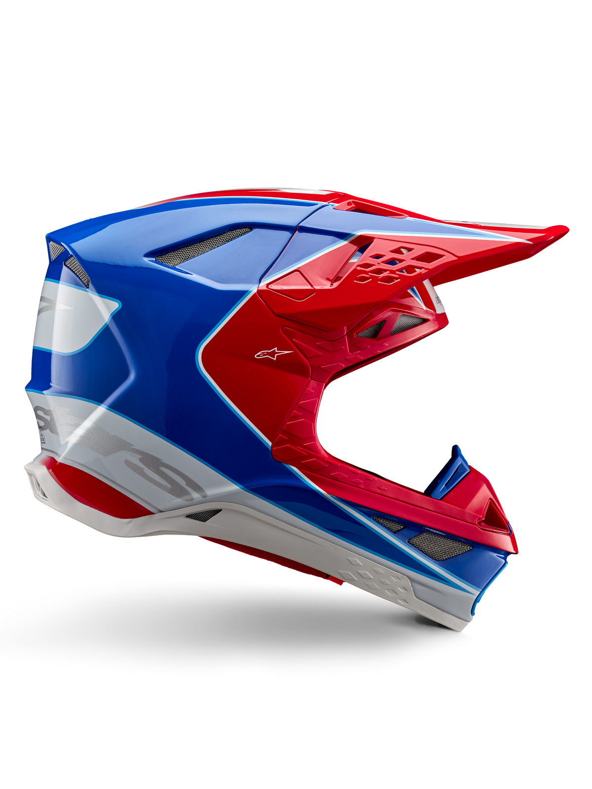 Alpinestars Supertech M10 Aeon, casco da motocross, rosso brillante, blu e bianco, finitura lucida, profilo laterale aerodinamico con molteplici prese d'aria coperte da rete, contorni angolari e visiera