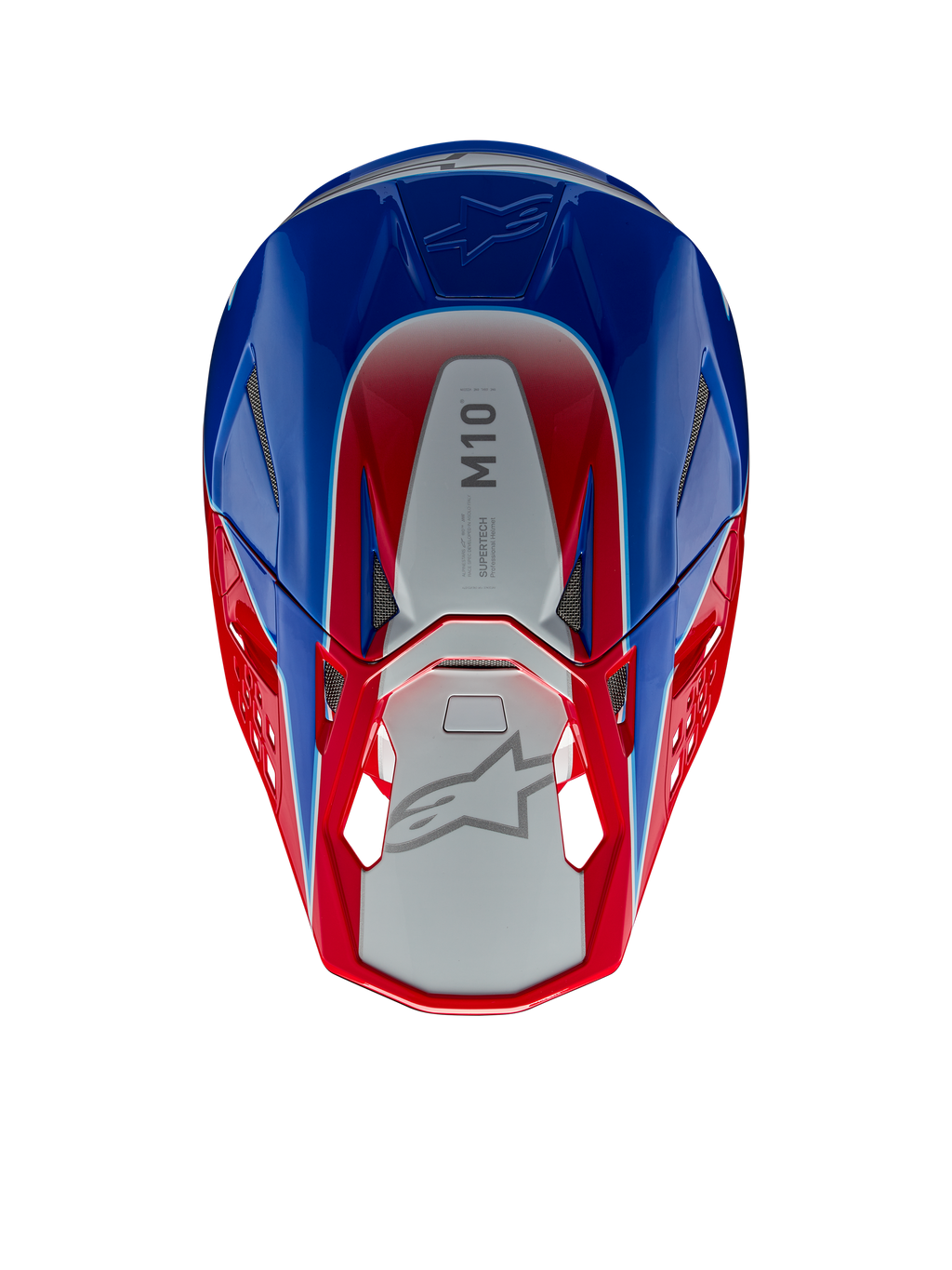 Casco Alpinestars Supertech M10 Aeon, casco da motocross, rosso e blu lucido, vista dall'alto con pannello centrale argento e marchio M10, calotta aerodinamica con accenti rossi e blu, prese d'aria in rete, protezione per la testa ad alte prestazioni
