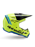 Casco Alpinestars S-M3 Youth Radium, casco da motocross per ragazzi, giallo fluo brillante con accenti neri e blu, vista laterale che mostra il design aerodinamico, visiera nera con logo giallo, branding nero sul lato, protezione certificata ECE 22.06 per gare off-road