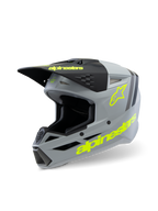 Casco Alpinestars S-M3 Youth Radium ECE 22.06, casco da motocross, grigio opaco e nero con accenti giallo fluo, branding Alpinestars e logo a stella, equipaggiamento protettivo per fuoristrada per ragazzi
