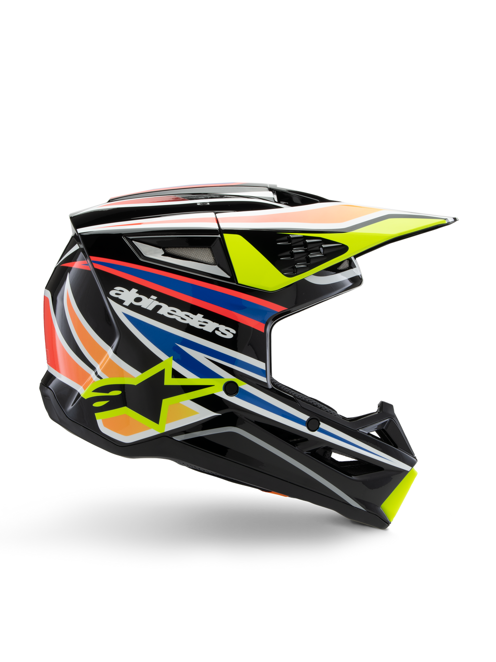 Casco Alpinestars S-M3 Youth Wurx, casco da motocross per ragazzi, nero con strisce grafiche gialle, blu, rosse e arancioni, profilo laterale con visiera aerodinamica e finitura lucida, con logo Alpinestars bianco e grafica con stella gialla