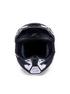 Casco Alpinestars S-M7 Dasher ECE 22.06, casco da motocross, nero opaco e bianco, vista frontale con prese d'aria e grafiche geometriche, presenta la scritta "ONE GOAL - ONE VISION", protezione professionale per competizioni fuoristrada