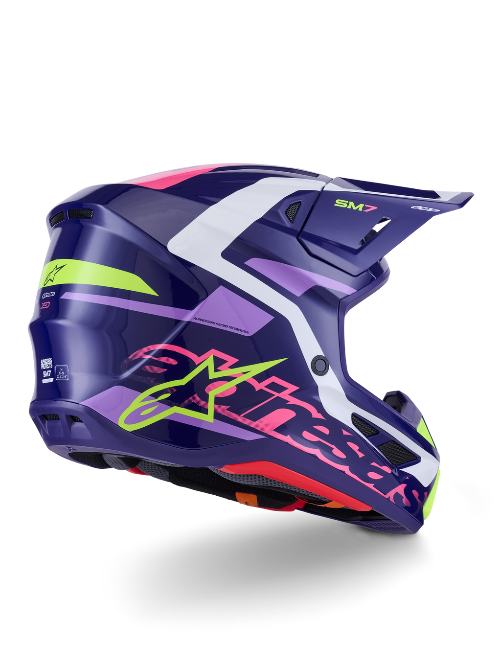Casco Alpinestars S-M7 Deed, casco da motocross, viola e rosa lucido, vista laterale-posteriore con accenti bianchi e verde lime, scritta Alpinestars rosa acceso e logo a stella, calotta in composito dal design aerodinamico per prestazioni fuoristrada