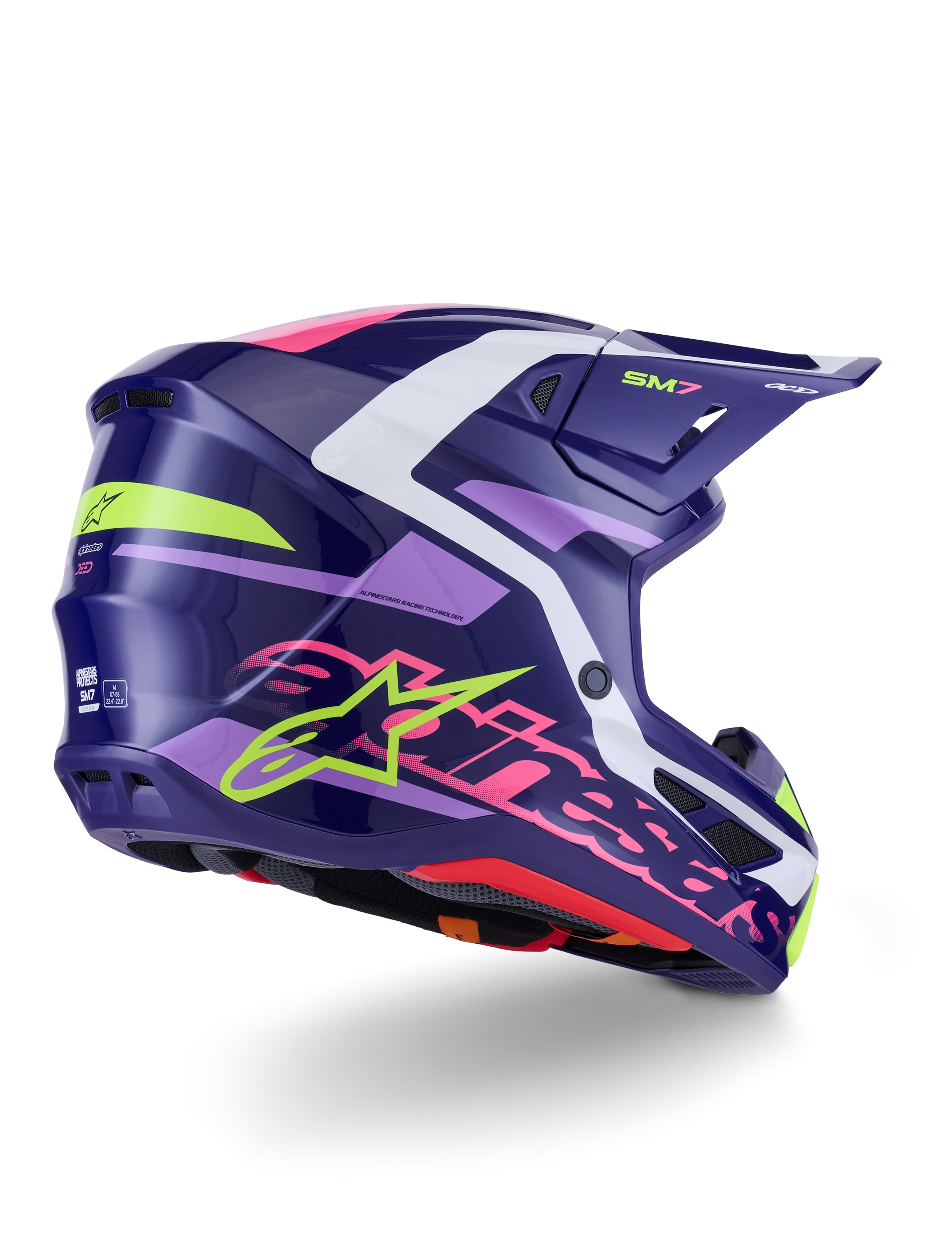 Casco Alpinestars S-M7 Deed, casco da motocross, viola e rosa lucido, vista laterale-posteriore con accenti bianchi e verde lime, scritta Alpinestars rosa acceso e logo a stella, calotta in composito dal design aerodinamico per prestazioni fuoristrada