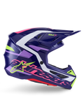 Casco Alpinestars S-M7 Deed, casco da motocross, viola e rosa lucido, vista laterale, con accenti grafici bianchi e verde lime, branding SM7 e logo Alpinestars, design della calotta aerodinamica in materiale composito per corse fuoristrada