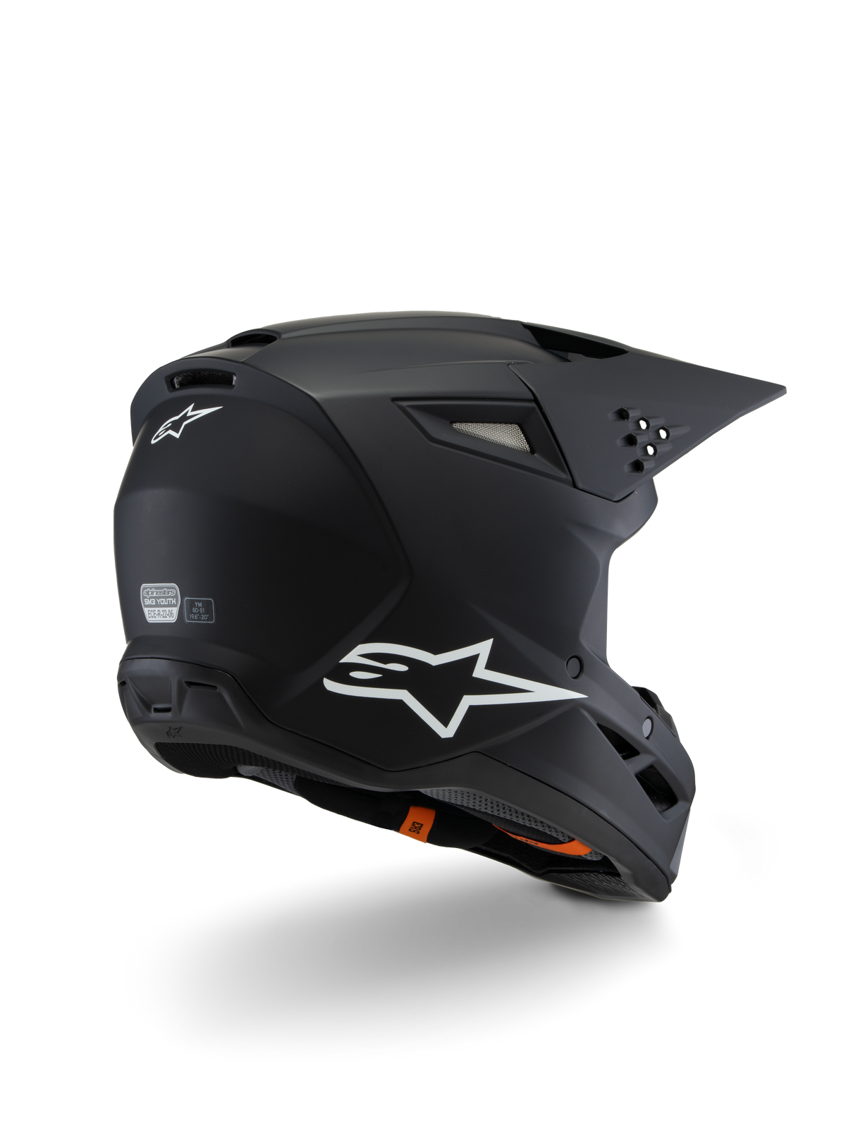 Alpinestars S-M3 Youth Solid Helmet ECE 22.06, casco da motocross, nero opaco, vista posteriore di tre quarti con loghi Alpinestars bianchi, design della calotta aerodinamico con visiera integrata e prese d'aria, protezione off-road per ragazzi