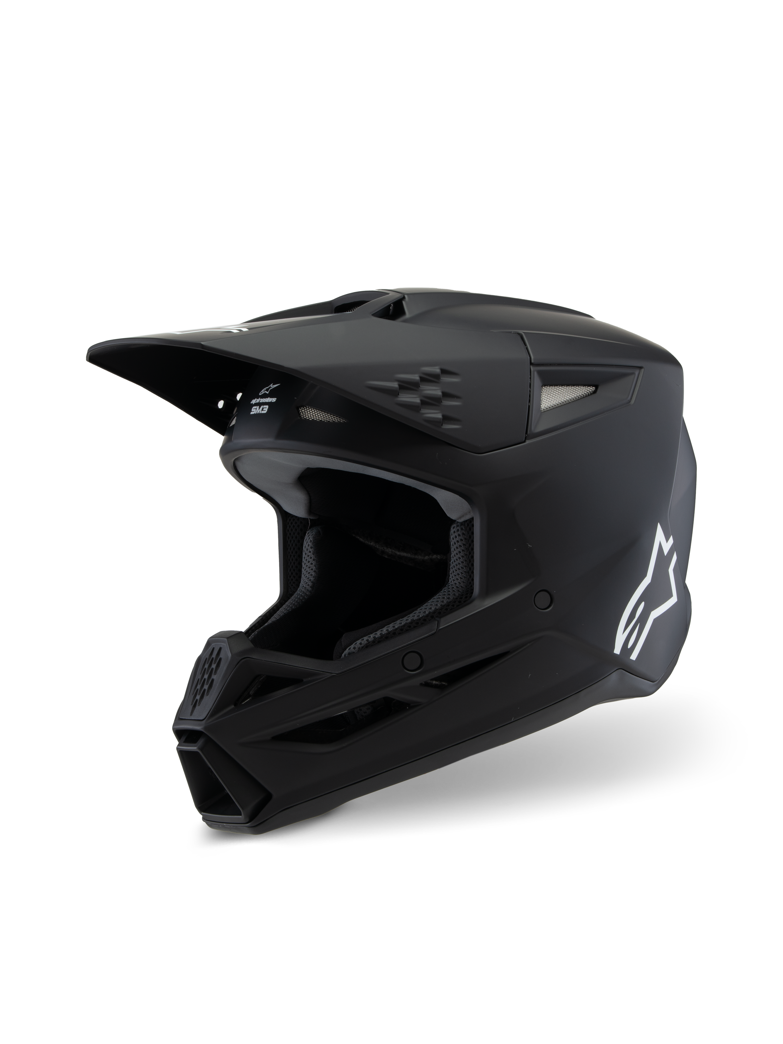 Alpinestars S-M3 Youth Solid Helmet ECE 22.06, casco da motocross, nero opaco, vista di profilo laterale con logo Alpinestars bianco, calotta aerodinamica con prese d'aria e visiera integrata, protezione professionale per la testa off-road per giovani piloti