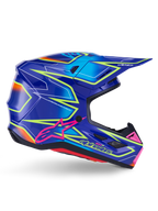 Casco Alpinestars S-M7 Cast, casco da motocross, blu, rosa e giallo fluo lucido, vista di profilo laterale con motivi geometrici audaci, logo Alpinestars rosa e calotta aerodinamica ventilata