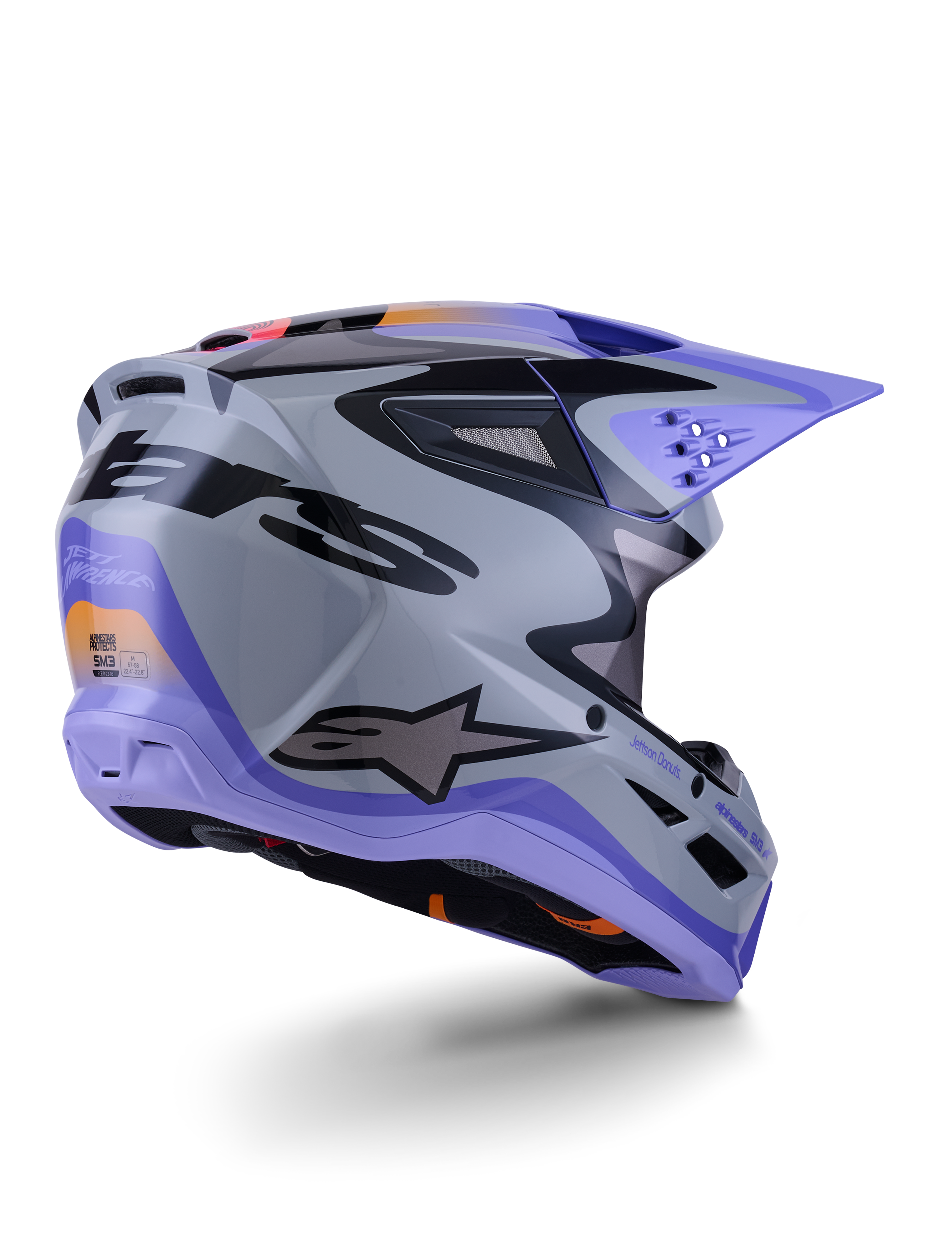 Casco Alpinestars S-M3 Jettson ECE 22.06, casco da motocross, grigio porpora e nero lucido, vista posteriore di tre quarti che mostra la calotta aerodinamica termo-iniettata con prese d'aria e un design grafico audace