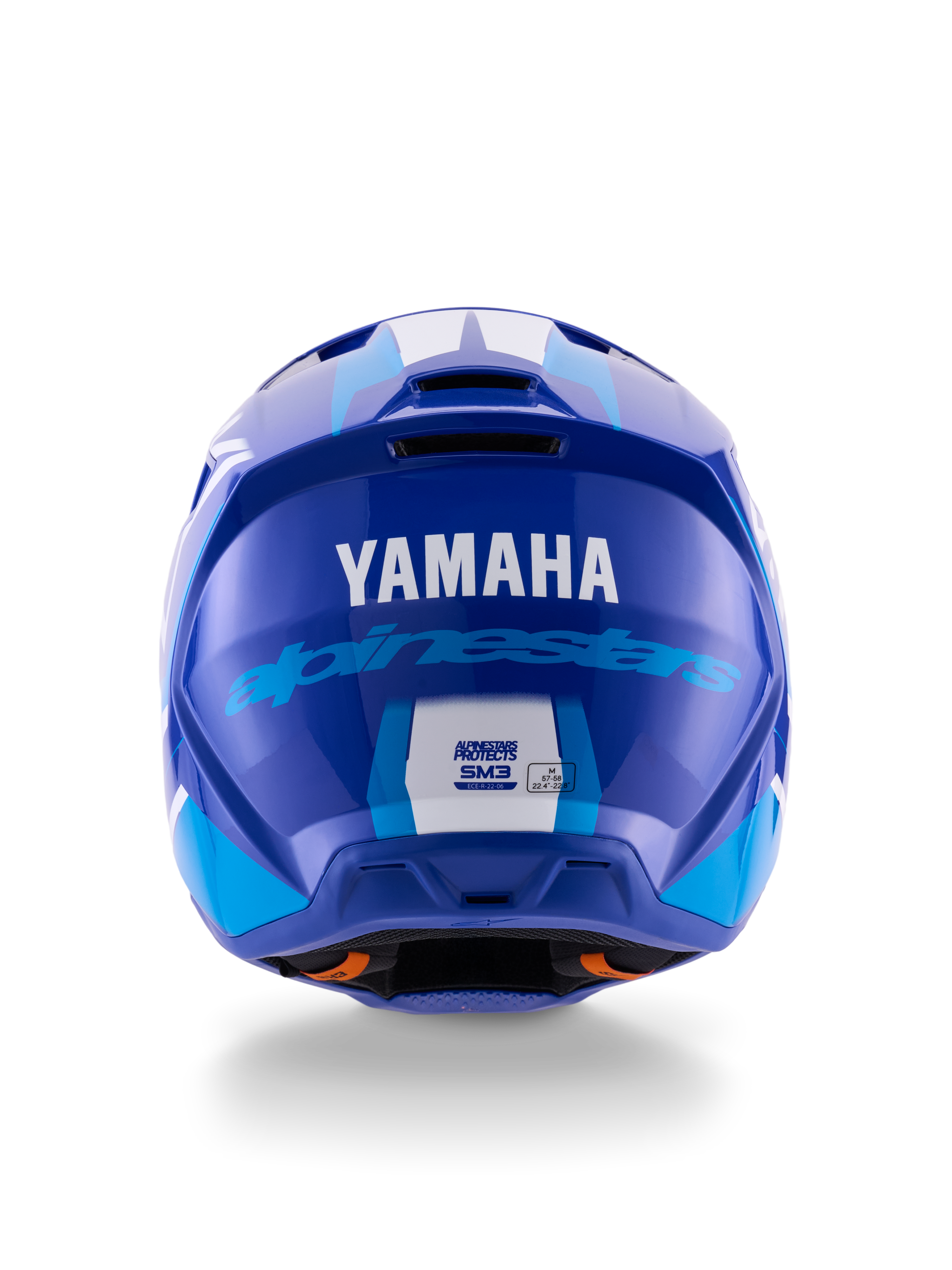 Casco Alpinestars Yamaha S-M3, casco da motocross, blu e bianco lucido, vista posteriore con logo YAMAHA bianco e scritta Alpinestars blu, finitura lucida con prese d'aria visibili ed etichette di certificazione di sicurezza