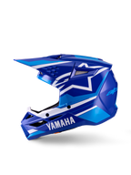 Casco da motocross Yamaha S-M3 per ragazzi, casco da motocross, blu e bianco lucido, vista di profilo laterale, con marchio Yamaha sulla mentoniera e logo a stella Alpinestars, calotta aerodinamica con prese d'aria multiple e frontino integrato.
