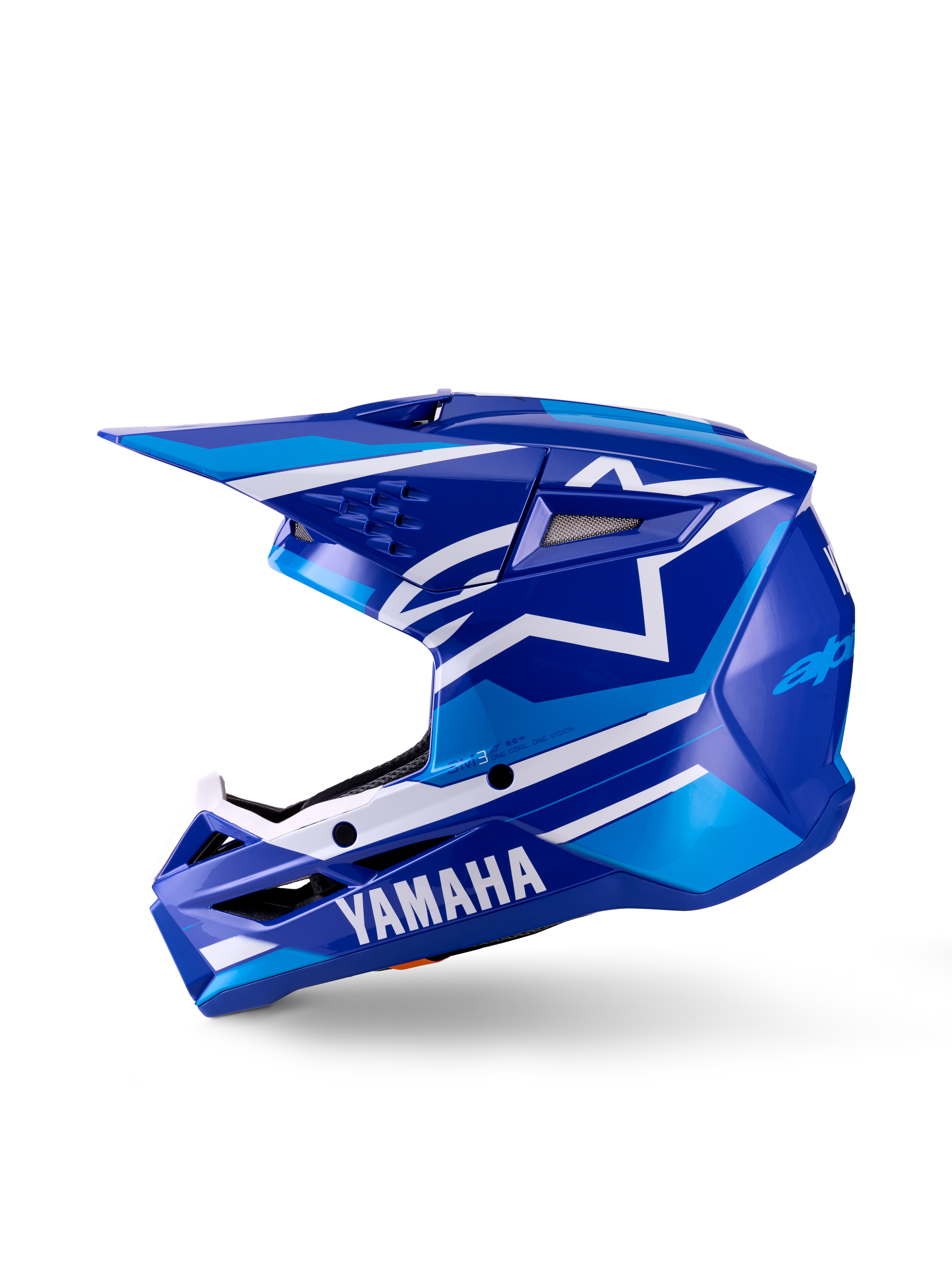 Casco da motocross Yamaha S-M3 per ragazzi, casco da motocross, blu e bianco lucido, vista di profilo laterale, con marchio Yamaha sulla mentoniera e logo a stella Alpinestars, calotta aerodinamica con prese d'aria multiple e frontino integrato.