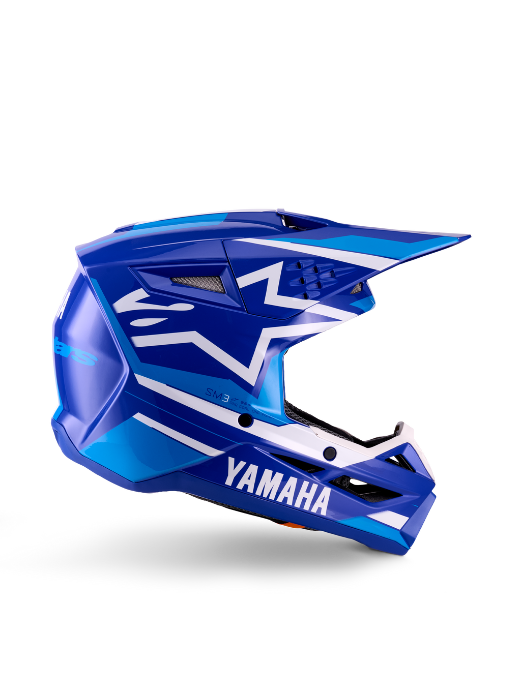 Casco da motocross Yamaha S-M3 Youth, blu e bianco lucido, vista laterale con branding Yamaha e logo a stella Alpinestars, design geometrico con accenti azzurri, calotta ventilata con visiera lunga, protezione per la testa off-road certificata ECE 22.06