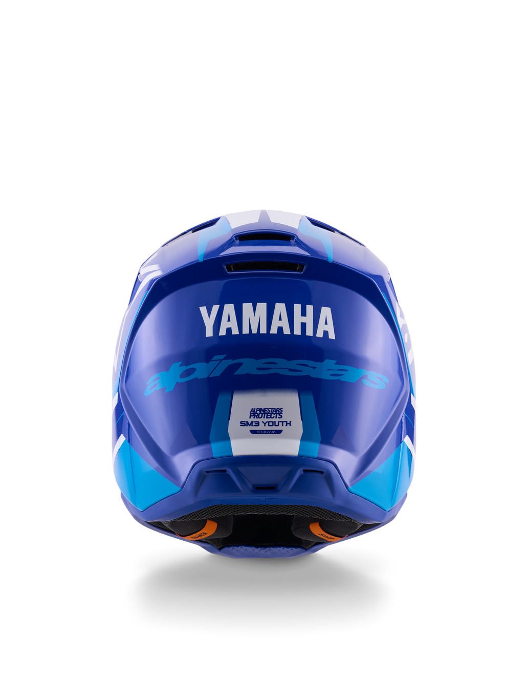 Casco da motocross per ragazzi Yamaha S-M3, vista posteriore, blu e bianco lucido, con loghi Yamaha e Alpinestars ben visibili, design della calotta aerodinamico con etichetta di certificazione ECE 22.06, protezione professionale per gare fuoristrada