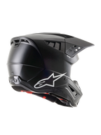 Alpinestars S-M5 Solid ECE 22.06, casco da motocross nero opaco, vista di profilo laterale-posteriore con logo Alpinestars bianco, molteplici porte di ventilazione e visiera integrata per la protezione nel fuoristrada