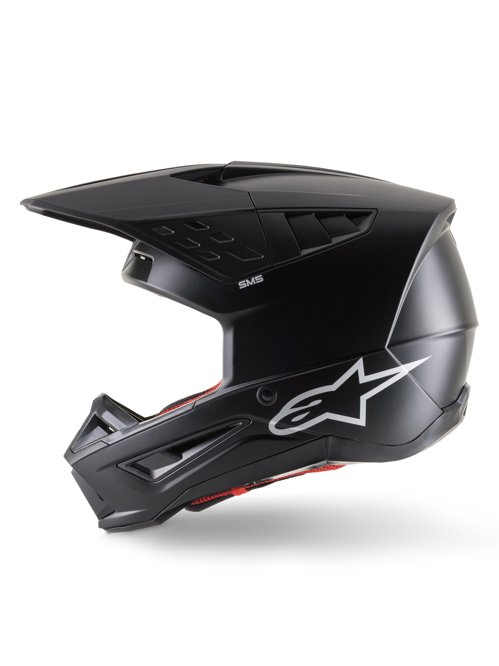 Casco Alpinestars S-M5 Solid ECE 22.06, casco da motocross, nero opaco, vista laterale di profilo con finitura opaca, logo Alpinestars bianco sul lato, imbottitura interna rossa e calotta aerodinamica con porte di ventilazione integrate