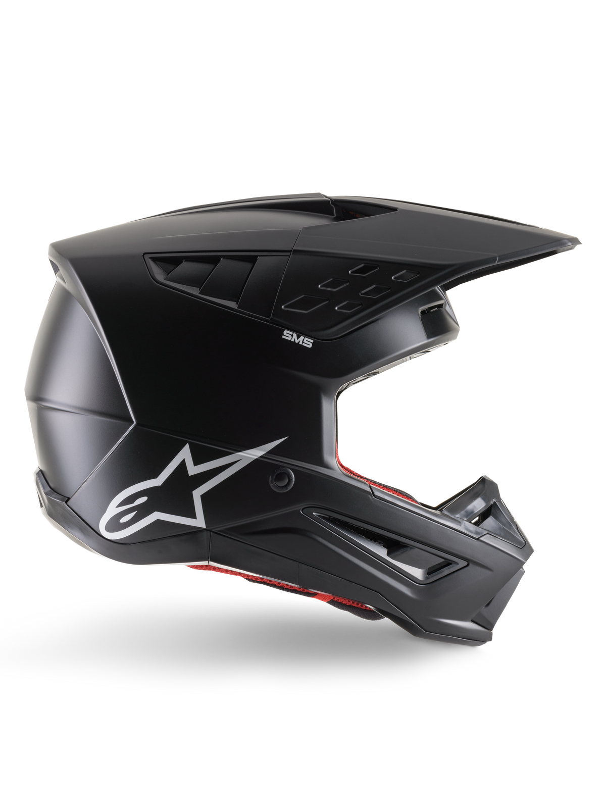 Casco Alpinestars S-M5 Solid, casco da motocross, nero opaco, con logo Alpinestars a stella bianco e rivestimento interno rosso, design aerodinamico con prese d'aria multiple e visiera lunga, protezione off-road certificata ECE 22.06