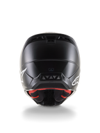 Vista posteriore del casco Alpinestars S-M5 Solid ECE 22.06, casco da motocross, finitura nero opaco, loghi Alpinestars bianchi sui lati, fodera interna rossa, calotta aerodinamica con prese d'aria di scarico.