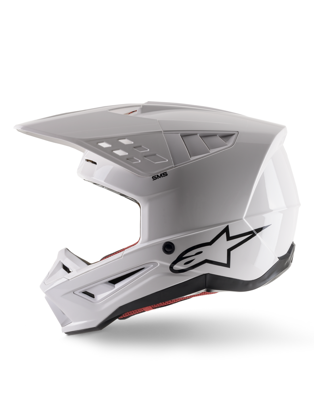 Alpinestars S-M5 Solid Helmet ECE 22.06, casco da motocross, bianco lucido, vista di profilo laterale con design angolare della calotta, logo Alpinestars nero sul lato, molteplici porte di ventilazione e visiera integrata per corse fuoristrada
