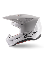 Alpinestars S-M5 Solid Helmet ECE 22.06, casco da motocross, bianco lucido, vista di profilo laterale con design angolare della calotta, logo Alpinestars nero sul lato, molteplici porte di ventilazione e visiera integrata per corse fuoristrada