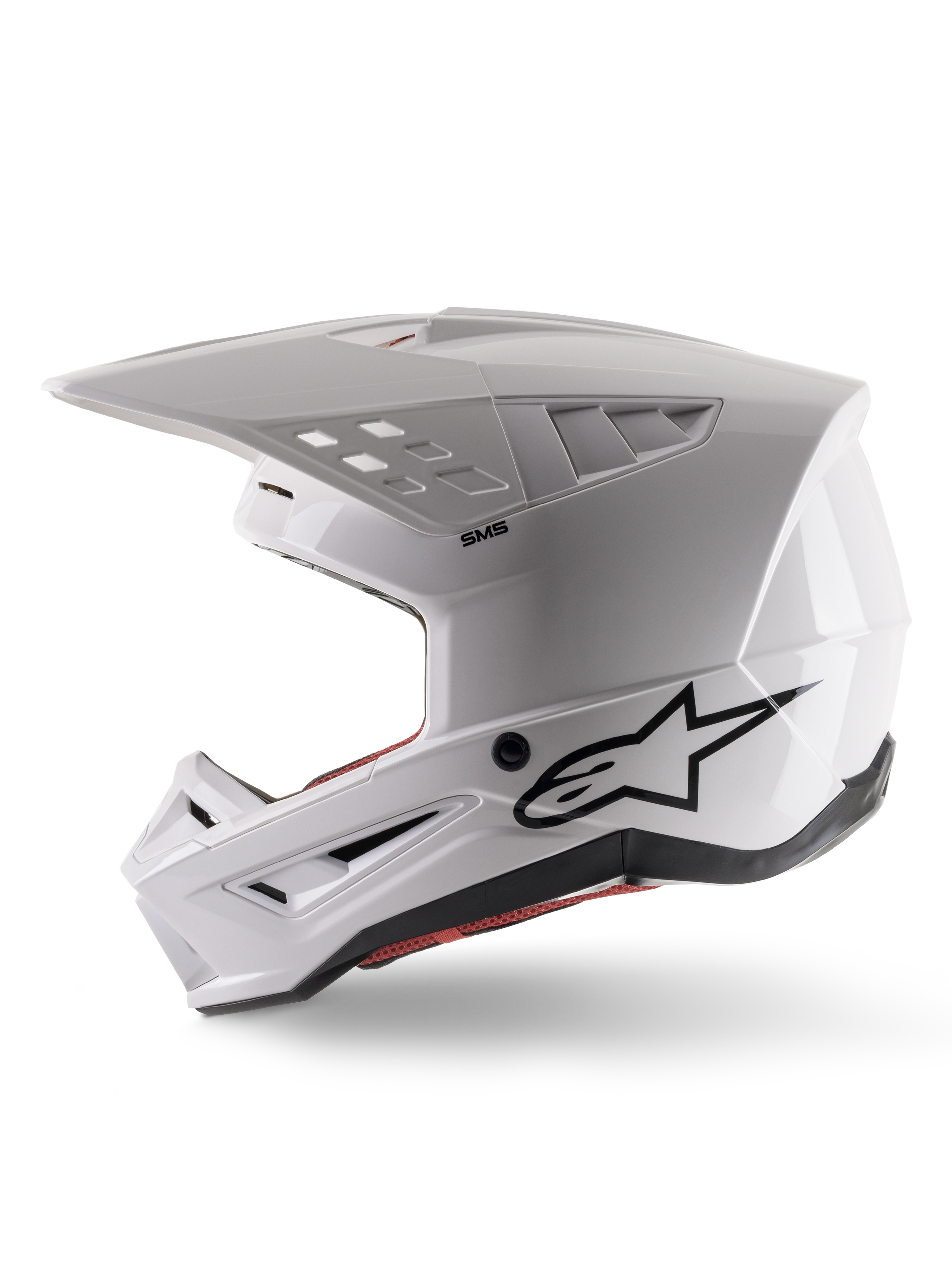 Alpinestars S-M5 Solid Helmet ECE 22.06, casco da motocross, bianco lucido, vista di profilo laterale con design angolare della calotta, logo Alpinestars nero sul lato, molteplici porte di ventilazione e visiera integrata per corse fuoristrada