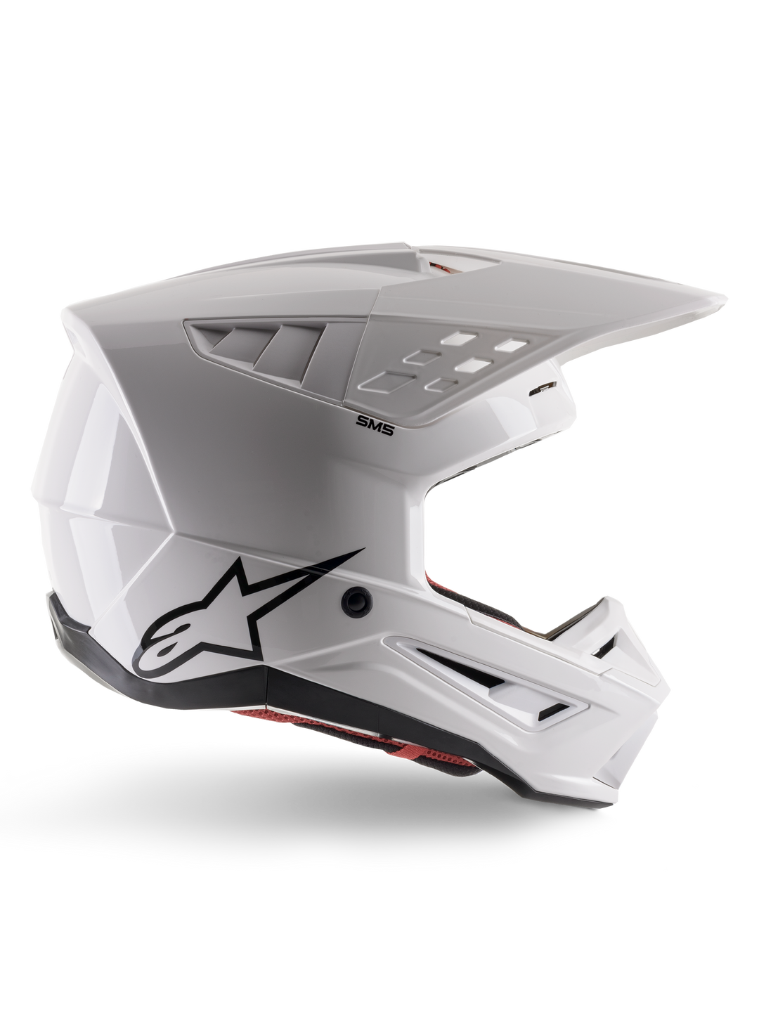 Alpinestars S-M5 Solid Helmet ECE 22.06, casco da motocross, bianco lucido, profilo laterale con design aerodinamico angolare, visiera prominente, prese d'aria integrate, logo Astars nero sul retro e imbottitura interna rossa visibile