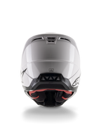 Casco Alpinestars S-M5 Solid ECE 22.06, casco da motocross, bianco lucido, vista posteriore con prese d'aria aerodinamiche e bordo inferiore nero con loghi, equipaggiamento protettivo elegante per gare fuoristrada