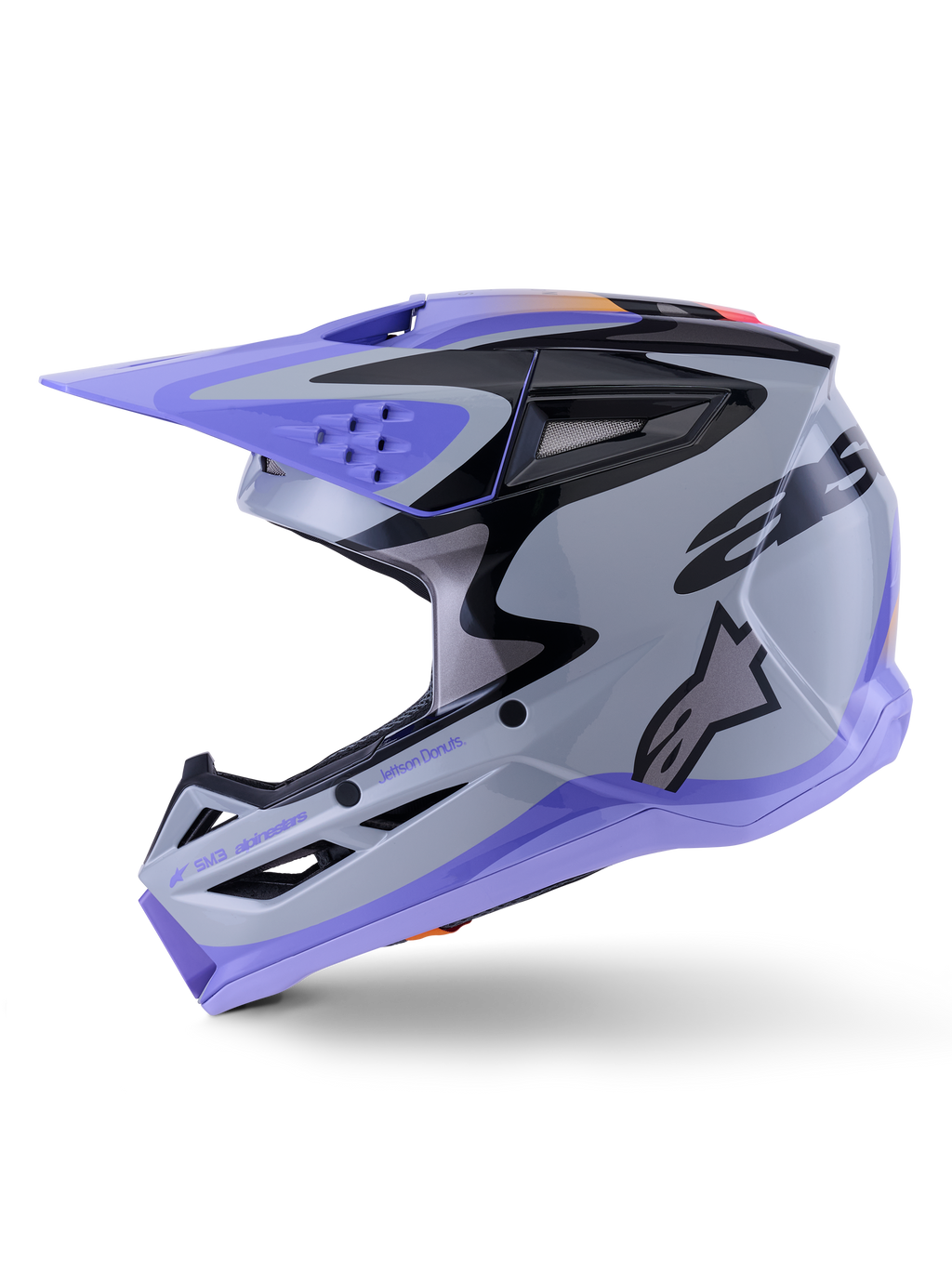 Casco Alpinestars S-M3 Jettson, casco da motocross, grigio, viola e nero lucido, vista laterale con grafiche eleganti e visiera regolabile, caratterizzato da numerose prese d'aria e logo Alpinestars, protezione per fuoristrada ad alte prestazioni