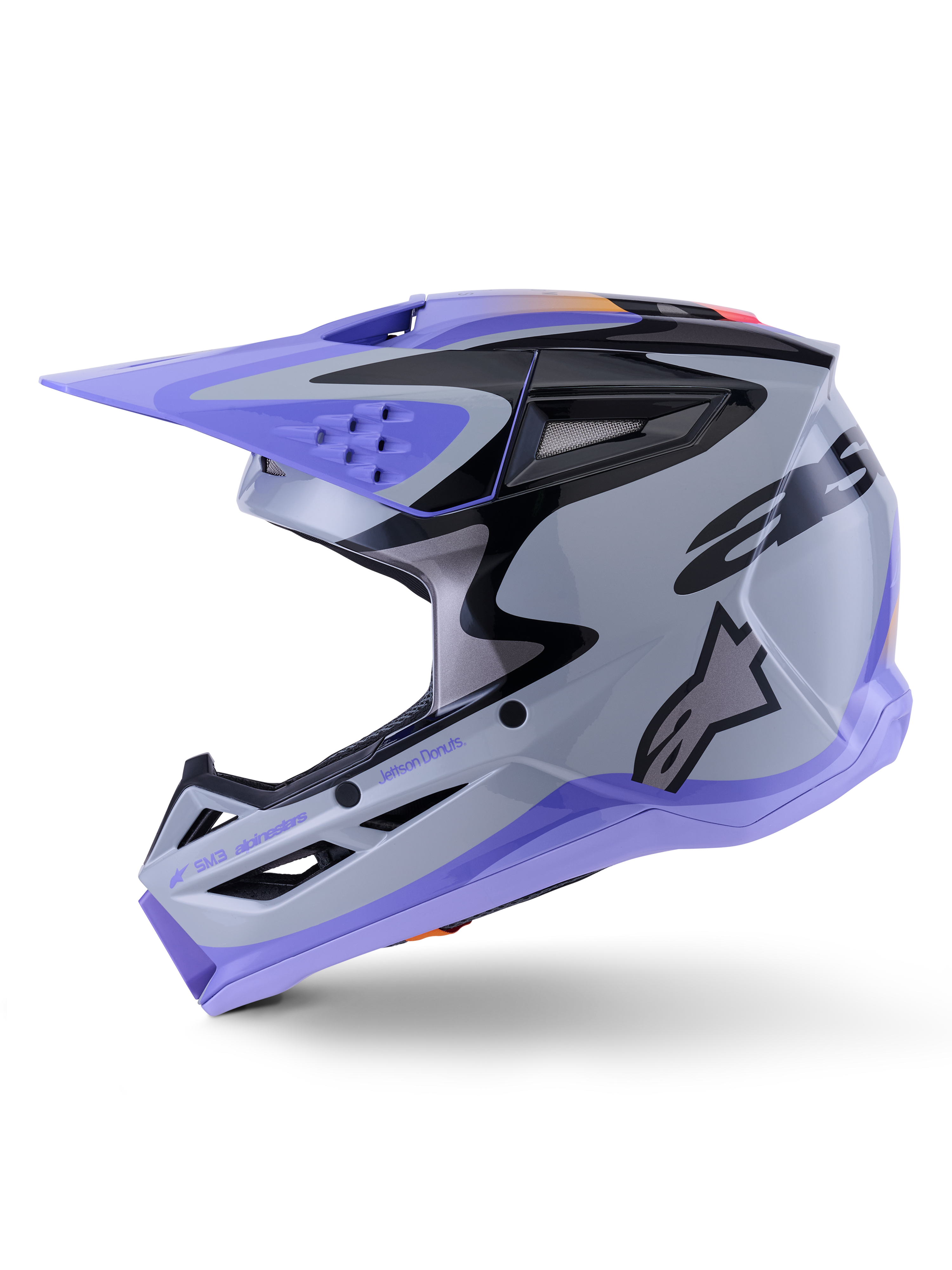 Casco Alpinestars S-M3 Jettson, casco da motocross, grigio, viola e nero lucido, vista laterale con grafiche eleganti e visiera regolabile, caratterizzato da numerose prese d'aria e logo Alpinestars, protezione per fuoristrada ad alte prestazioni