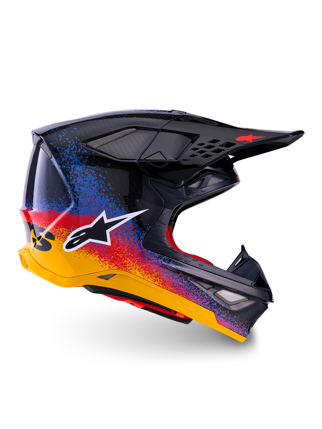 Casco Alpinestars Limited Edition Supertech M10 Black Hole, casco da motocross, calotta nera con design splatter sfumato rosso, blu e giallo, logo con stella bianca laterale, profilo aerodinamico con prese d'aria protette da rete, imbottitura interna rossa e visiera nera lunga