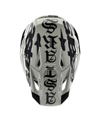 Casco Alpinestars Limited Edition S-M7 Wolf Dust, vista dall'alto, finitura lucida Dune e Nero, con un'audace tipografia in stile gotico sulla calotta e dettagli One Goal One Vision, protezione professionale per la testa da motocross