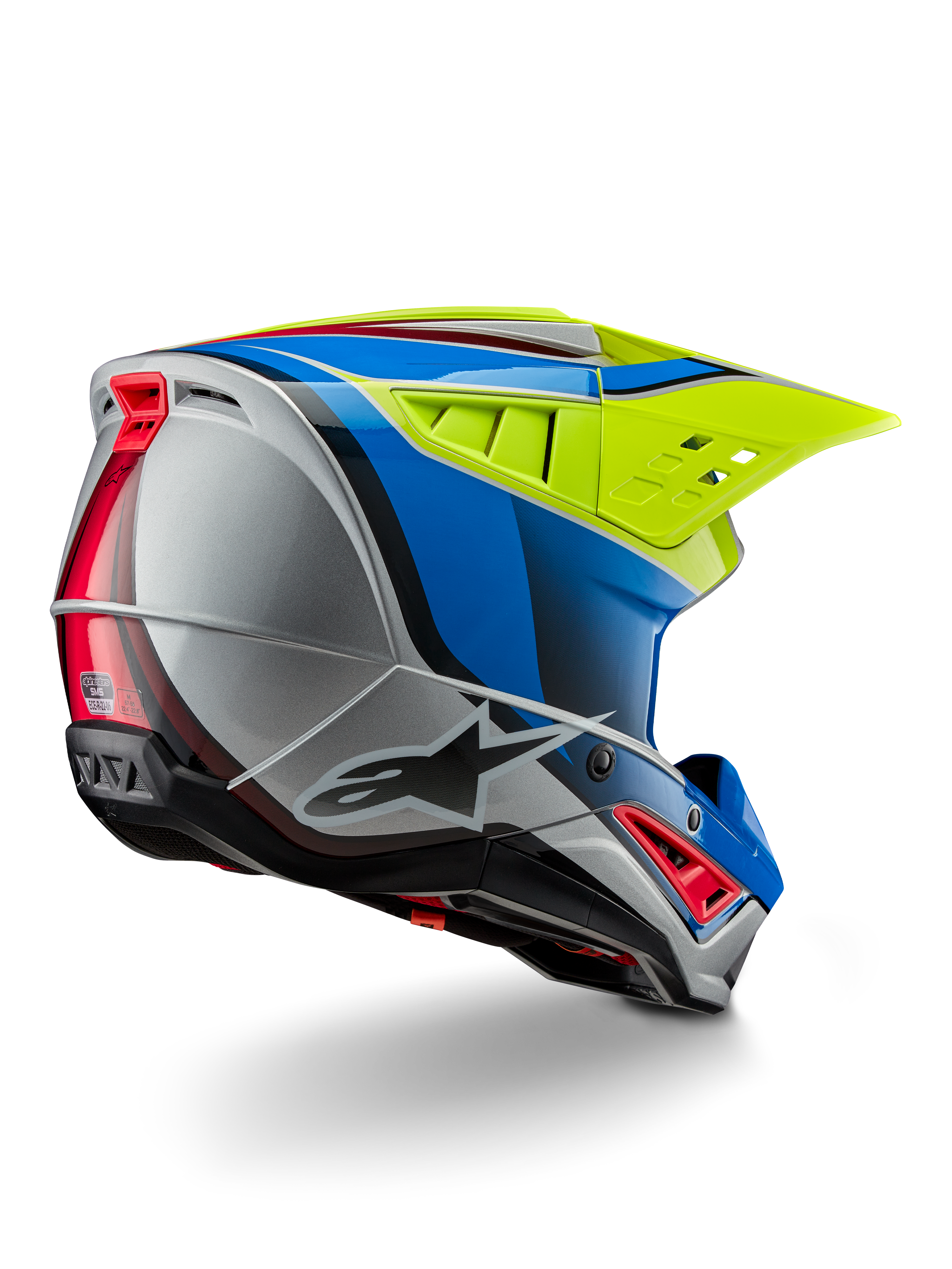 Alpinestars S-M5 Sail Helmet ECE, casco da motocross, giallo fluo, blu smalto e argento lucido, vista posteriore di tre quarti che mostra la calotta aerodinamica in materiale termoplastico, l'ampia visiera ventilata e le prese d'aria integrate per la protezione nelle corse fuoristrada.