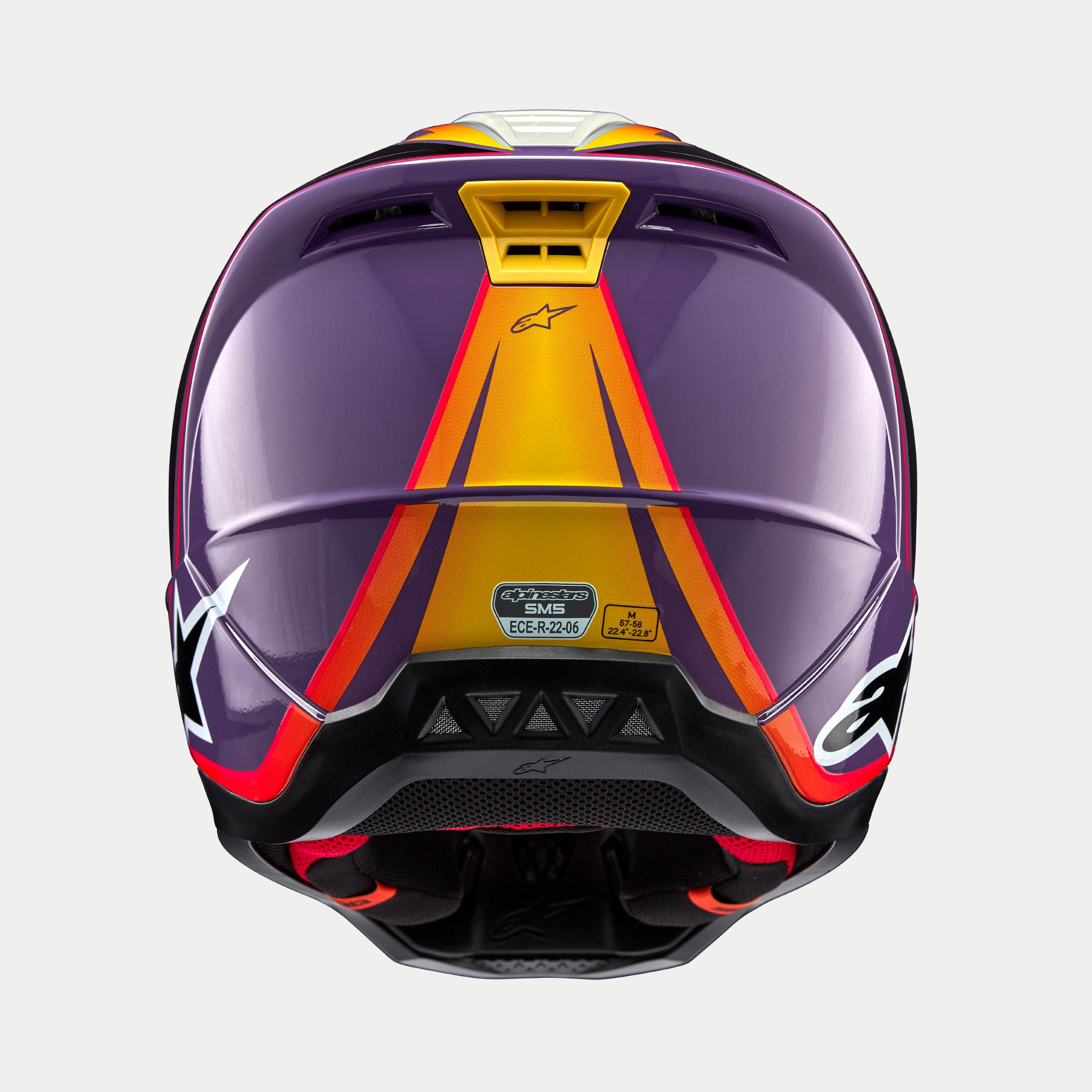 Alpinestars S-M5 Sail Helmet ECE, casco da motocross, violetto nero argento lucido, vista posteriore con grafiche sfumate arancioni e gialle su calotta viola, finitura lucida con loghi a stella bianchi sui lati, prese d'aria ed etichetta di certificazione ECE